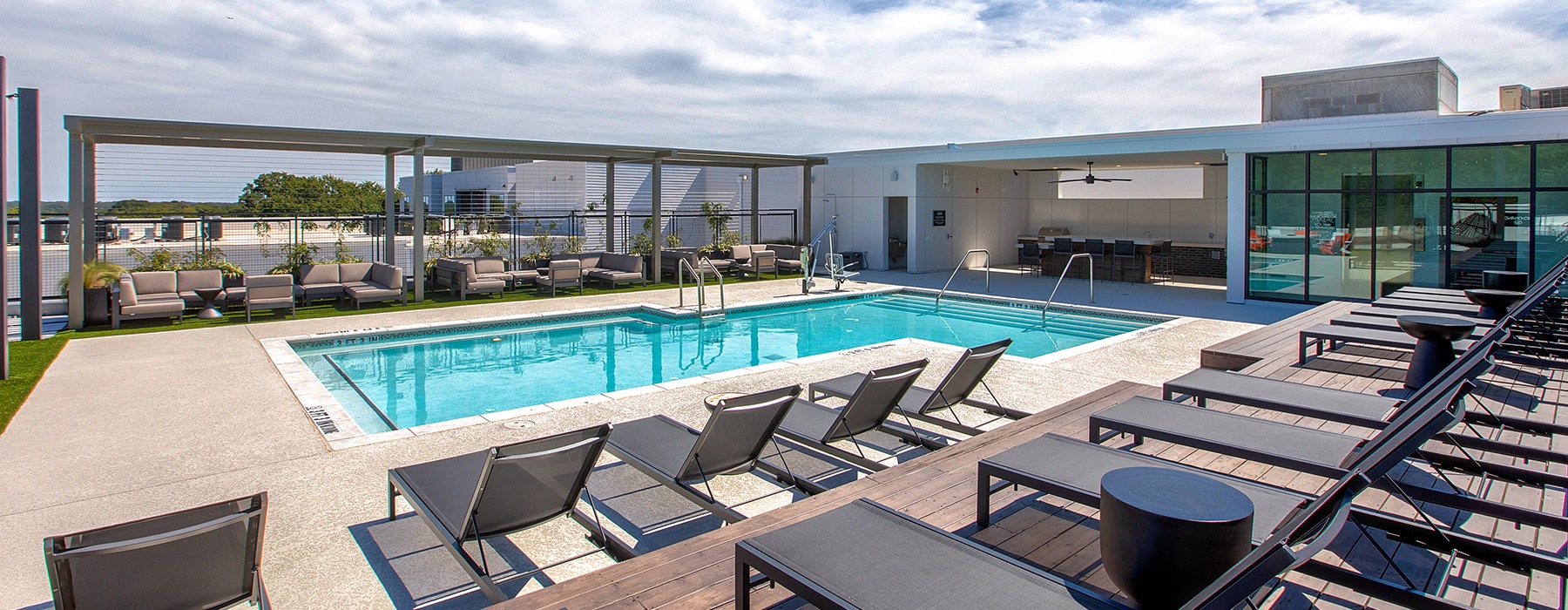 pool area with reclining chairs